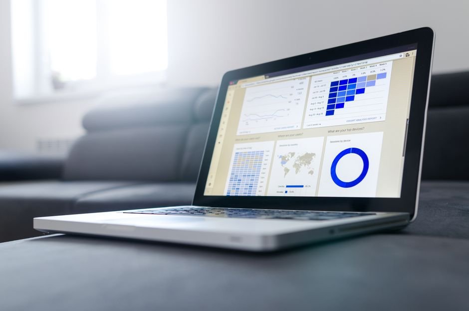 Sleek laptop showcasing data analytics and graphs on the screen in a bright room